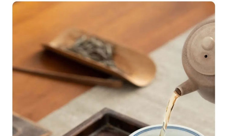 柴窑永乐青花压手杯双狮款